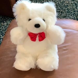 Plush bear with red bow tie